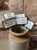 SET OF 6 PAINTED CAST IRON COMICAL PLANT SIGNS STAKES
