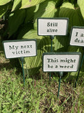SET OF 6 PAINTED CAST IRON COMICAL PLANT SIGNS STAKES