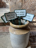 SET OF 6 PAINTED CAST IRON COMICAL PLANT SIGNS STAKES