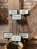 SET OF 6 PAINTED CAST IRON COMICAL PLANT SIGNS STAKES