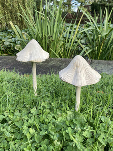 PAIR OF SMALL METAL CAST IRON TOADSTOOLS MUSHROOM STAKE GARDEN ORNAMENTS.