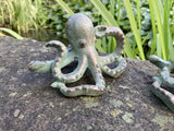 PAIR OF METAL CAST IRON OCTOPUS POND STATUE GARDEN ORNAMENTS.