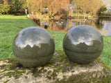 PAIR OF GREEN GLAZED TERRACOTTA BALLS / SPHERES GATE POST FINIALS