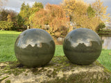 PAIR OF GREEN GLAZED TERRACOTTA BALLS / SPHERES GATE POST FINIALS