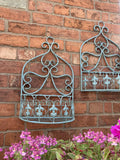 PAIR OF SMALL BLUE METAL HANGING GARDEN WALL PLANTERS