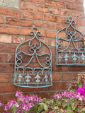 PAIR OF SMALL BLUE METAL HANGING GARDEN WALL PLANTERS