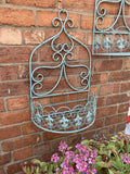 PAIR OF LARGE BLUE METAL HANGING GARDEN WALL PLANTERS