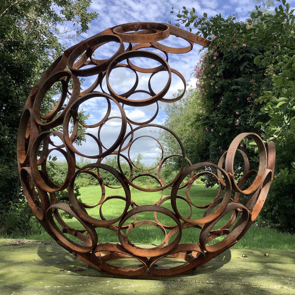 Rusty modern art open sphere garden ornament metal ferney heyes Audlem cheshire sculpture large metal