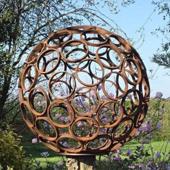 Rusty metal garden sphere feature ferney Heyes ornament